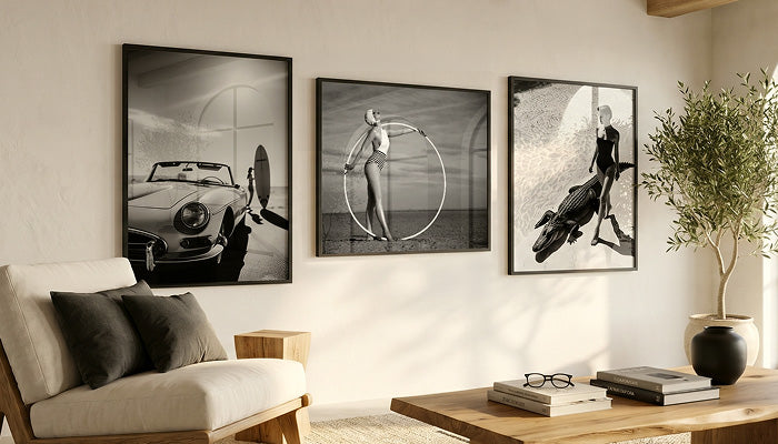 A gallery wall features six art prints, including black-and-white pieces—portraits of women, a leopard in a grand hall, a swimmer underwater, and vintage-style photography.