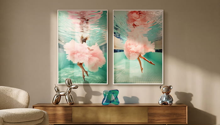 A gallery wall features six art prints, including colorful and black-and-white pieces—portraits of women, a leopard in a grand hall, a swimmer underwater, and vintage-style photography.